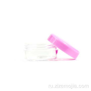 Маленькая пластиковая косметическая банка с розовой крышкой